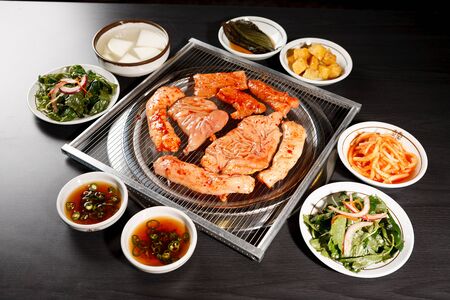 One serving sauced lamb tripe meal being cooked on grillの写真素材