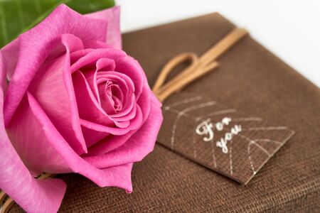 A bouquet of red and pink roses with box on white backgroundの写真素材