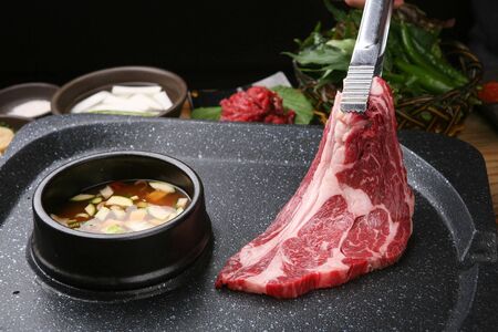 chunk of sirloin on grill with bean paste stewの写真素材
