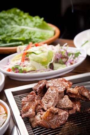 meat and vegetables on grillの写真素材