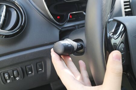 Hand on windshield wiper indicator