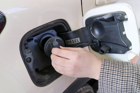 Hand  open the gas tank door