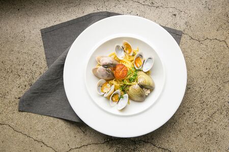 Spaghetti alle vongole on white plateの写真素材