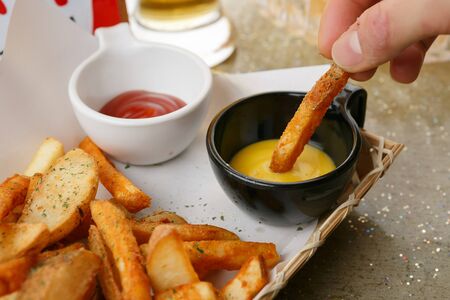 french fries dipped in mustard sauce
