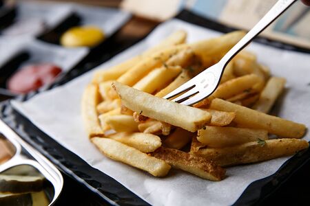 french fries on fork