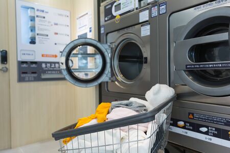 Single life concept, washing machines at laundromatの写真素材
