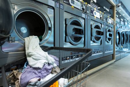 Single life concept, washing machines at laundromat