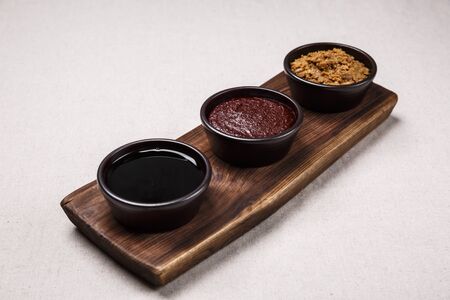 Concept of Korean traditional sauces, soy sauce, soybean paste and red pepper pasteの写真素材