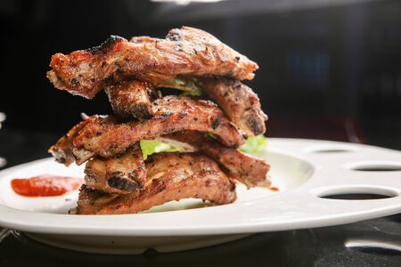 Grilled ribs on plate