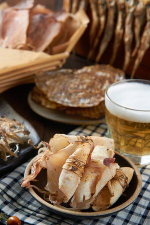Grilled dried squid and dried filefish fillet on a plateの写真素材