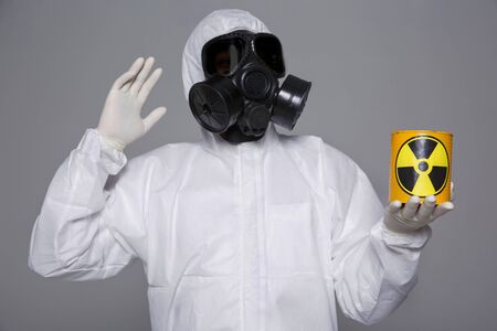 Male scientist in protective suit and antigas mask with glasses. 072