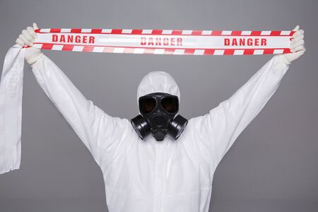Male scientist in protective suit and antigas mask with glasses. 013