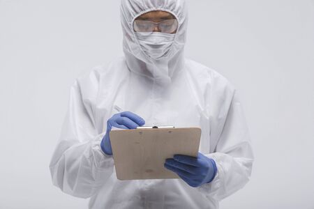 Male scientist in protective suit and antigas mask with glasses. 129