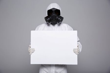 Male scientist in protective suit and antigas mask with glasses. 044の写真素材