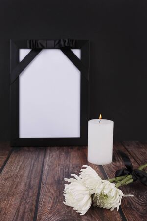 Frame, candle and white chrysanthemum flowerの写真素材