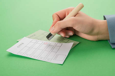 Voting and Election concept, voting paper in the ballot box 025