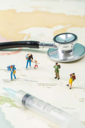 Miniature world concept- Miniature figurine of traveler, businessman, couple, family