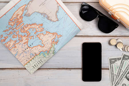 Travel concept- traveler accessories on wooden background