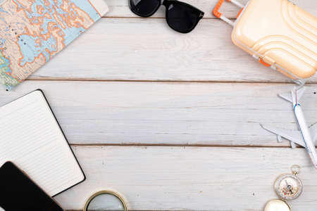Travel concept- traveler accessories on wooden background