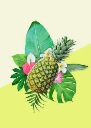Tropical background with a pineapple, flowers and various tropical leaves.の写真素材