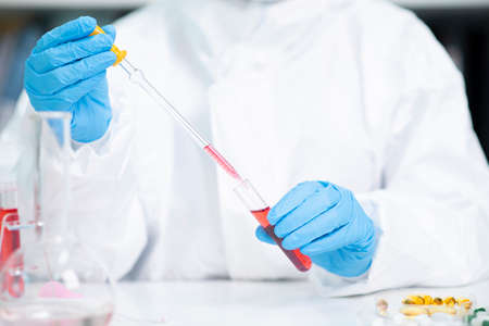 Science, chemistry, biology, and medicine concept, scientist with equipment and science experiments...