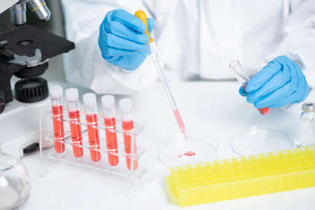 Science, chemistry, biology, and medicine concept, scientist with equipment and science experiments...