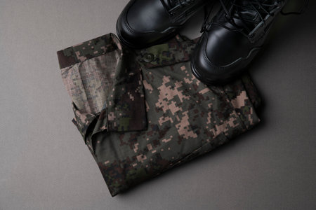Military symbols concep, South Korean flag and folded military uniform 09の写真素材