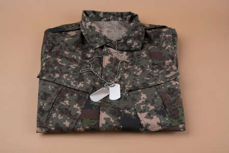 Military symbols concep, South Korean flag and folded military uniform 33の写真素材