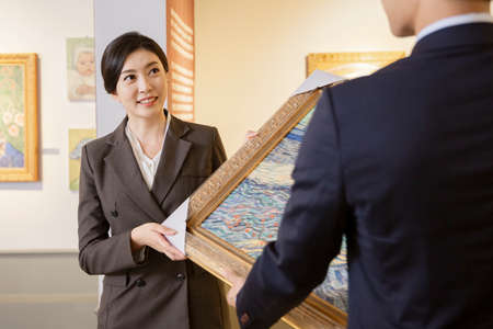 People with guide at exhibition in art gallery 016