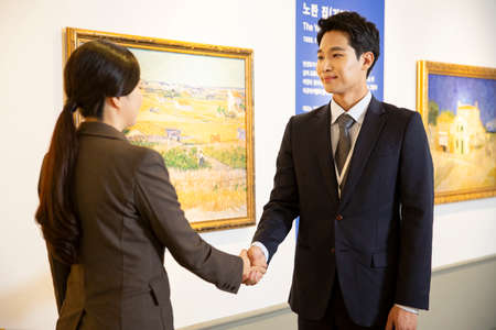 People with guide at exhibition in art gallery 019