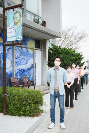 People with guide at exhibition in art gallery 001