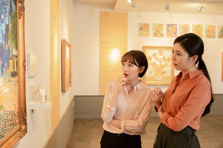 People with guide at exhibition in art gallery 042