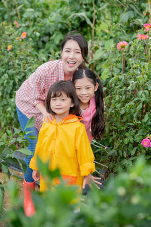 Portrait of happy cheerful family, young mother and two daughters 262