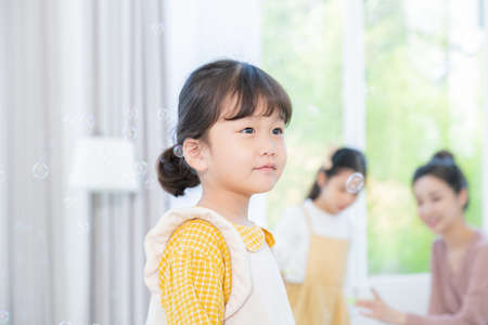 Portrait of happy cheerful family, young mother and two daughters 079の写真素材