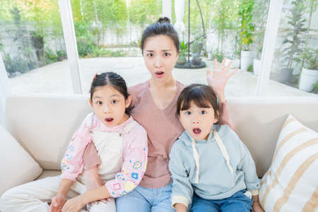 Portrait of happy cheerful family, young mother and two daughters 101の写真素材