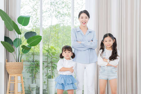 Portrait of happy cheerful family, young mother and two daughters 355