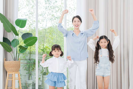 Portrait of happy cheerful family, young mother and two daughters 356の写真素材