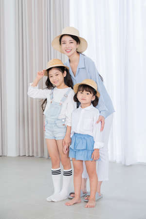 Portrait of happy cheerful family, young mother and two daughters 382