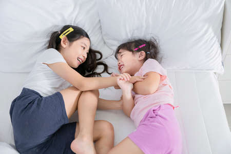 Portrait of happy cheerful family, young mother and two daughters 469の写真素材
