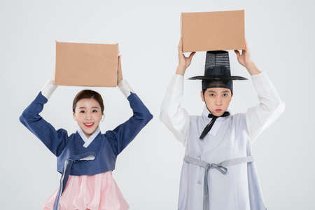 Male and female in Korean traditional clothes Hanbok. comic humorous concept. 156の写真素材