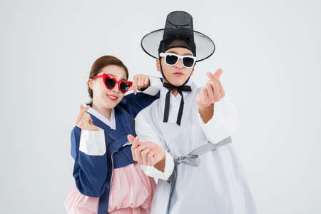 Male and female in Korean traditional clothes Hanbok. comic humorous concept. 022の写真素材