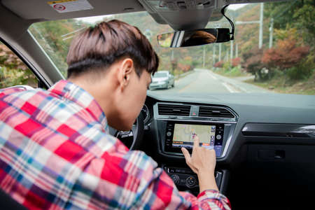 handsome Asian male model autumn travel conceptの写真素材