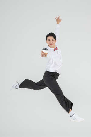 Asian male contemporary dancer with coffee