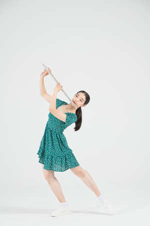 Asian female contemporary dancer with fluteの写真素材