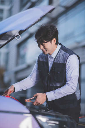 auto vehicle car insurance agent concept, checking car conditionの写真素材