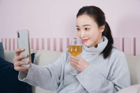 Asian single solo woman enjoying home alone time concept