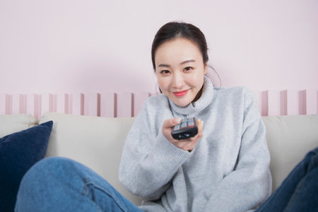 single solo woman living alone concept watching televisionの写真素材