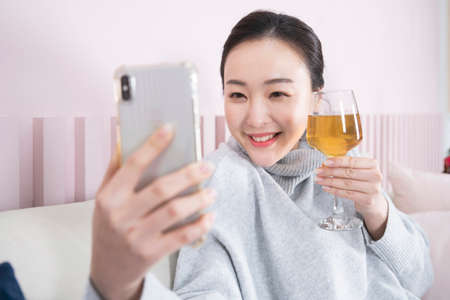 Asian single solo woman enjoying home alone time conceptの写真素材