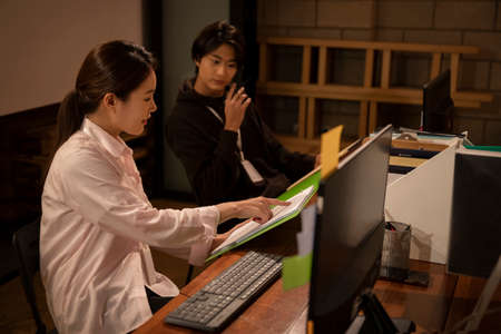 Young startup business concept working until lateの写真素材