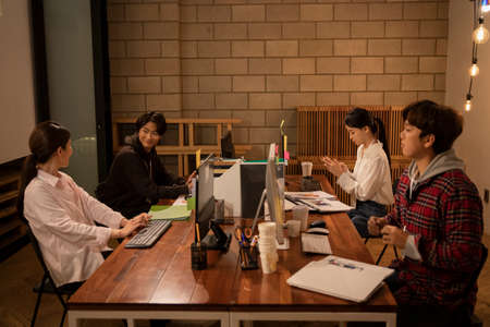 Young startup business concept working until late